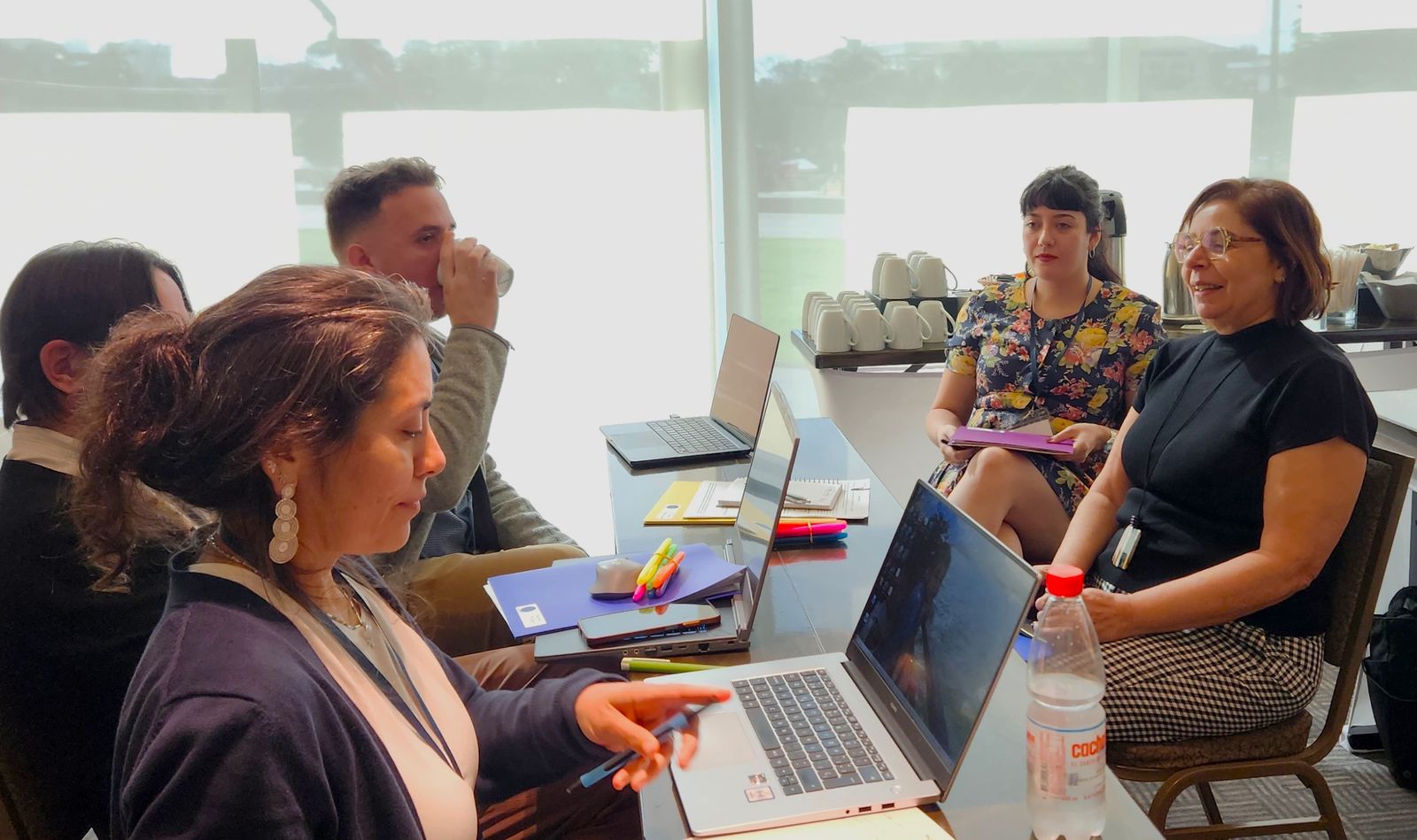 Researchers working together on laptops during a SALURBAL workshop
